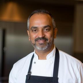 Professional headshot of Chef Rajesh Kumar, Head Chef and Owner of Spice Bites Cafe